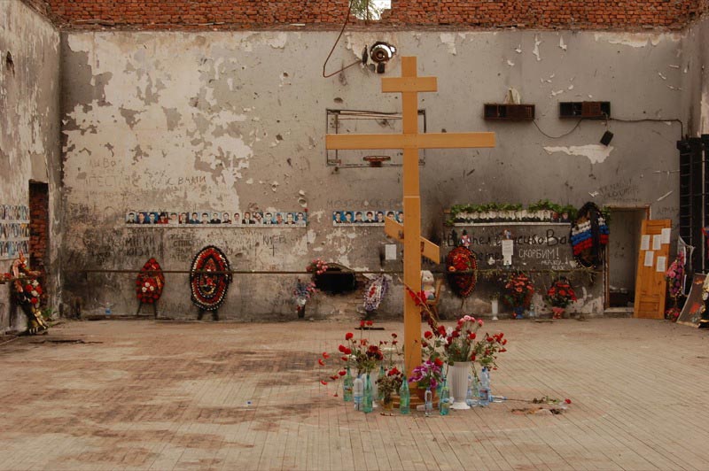 Photos and flowers in the former Beslan school gym. 
