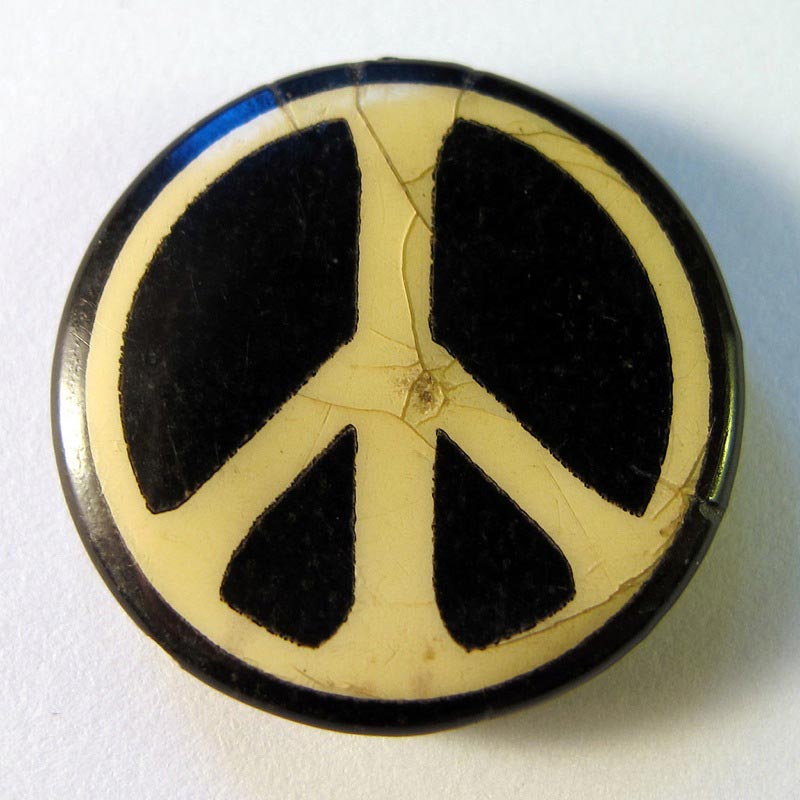 Small-sized badge, displaying the logo of the Campaign for Nuclear Disarmament. 