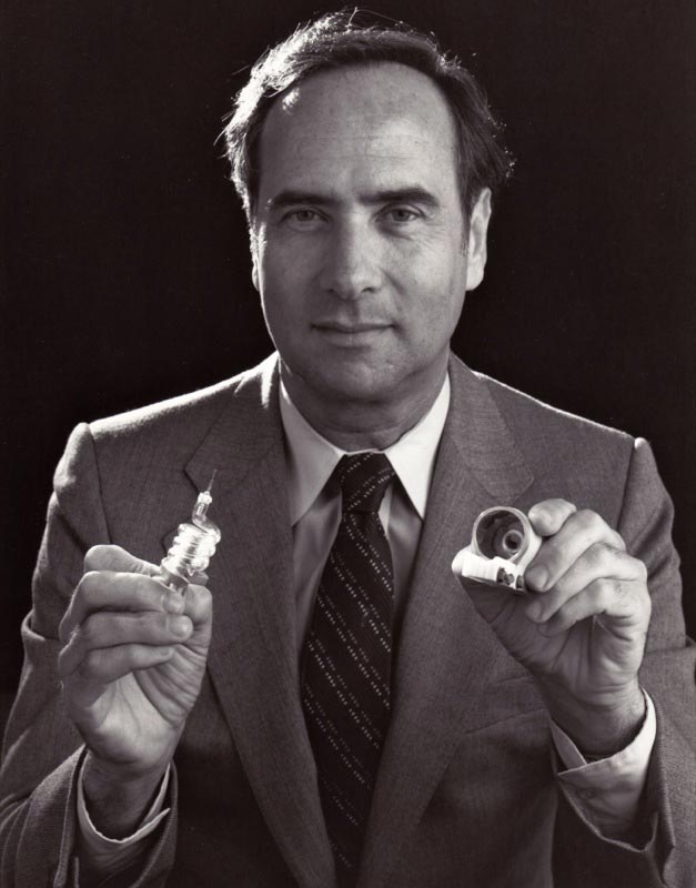 Theodore Maiman holding his invention of the world's first laser.