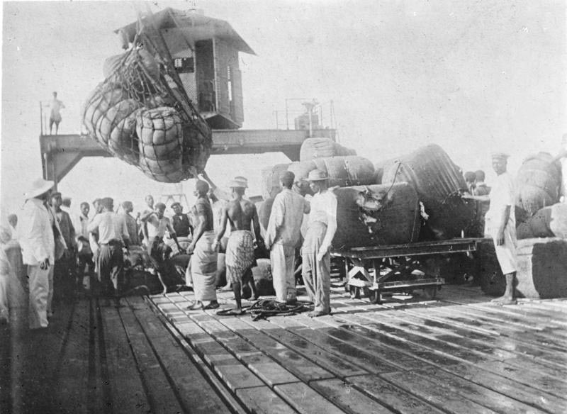 Loading of cotton bales onto the pier at Lome, Togoland in 1885.
