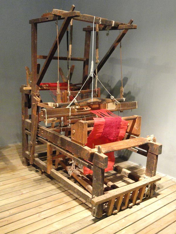 Naxi loom. Exhibit in the weaving collection in the Yunnan Nationalities Museum, Kunming, Yunnan, China.