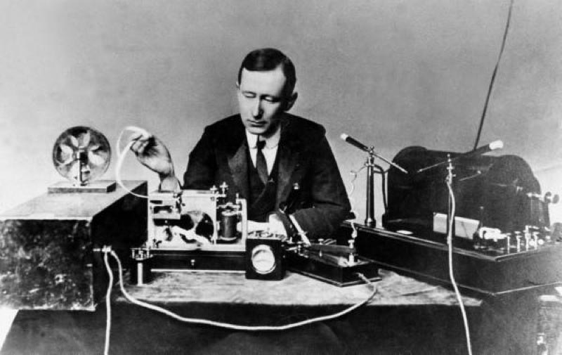 Guglielmo Marconi operating apparatus similar to that used by him to transmit first wireless signal across the Atlantic.