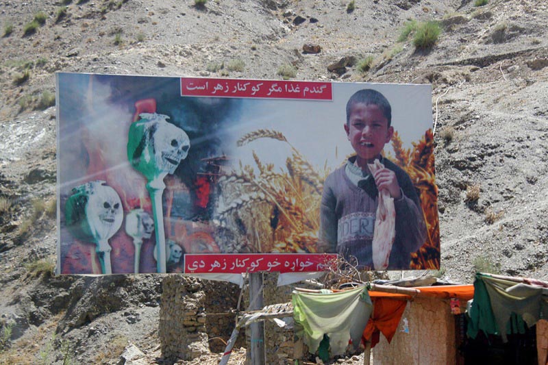 Anti-poppy poster in Afghanistan. Poster reads: "Poppies are the crop of death. Grow wheat and make bread".