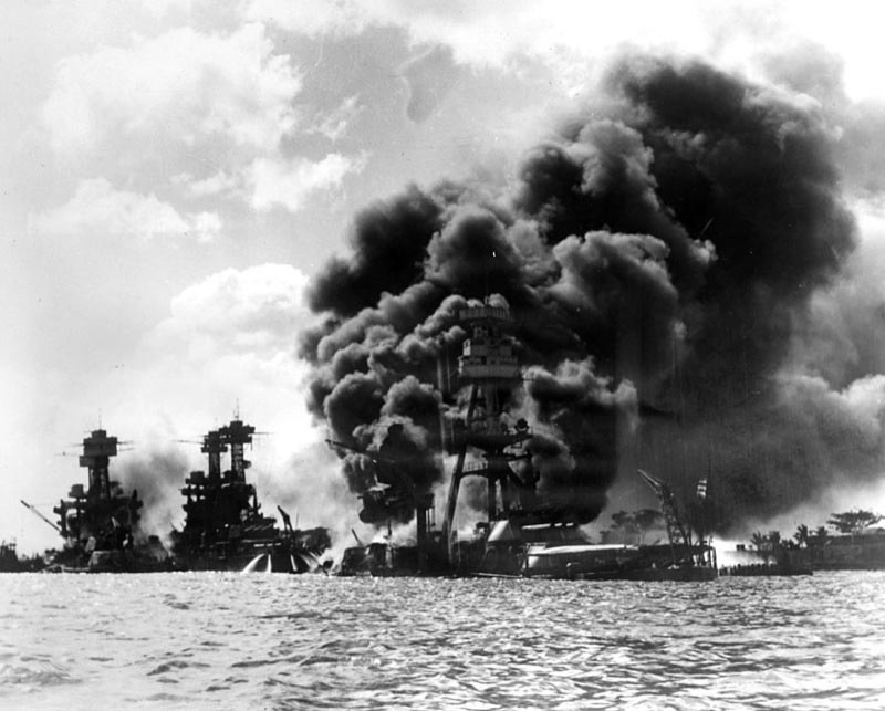 USS Arizona burning furiously in the aftermath of Pearl Harbour. 