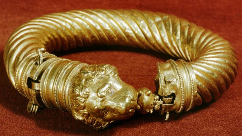 Roman bracelet with lion's head with an apple in its mouth.