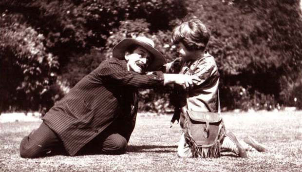 J. M. Barrie (as Hook) and Michael (as Peter Pan) on the lawn at Rustington, August 1906